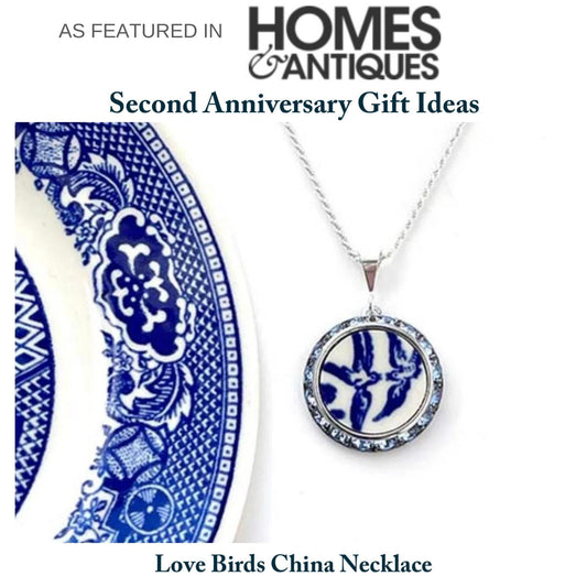 Necklace with a handmade round pendant that features the love birds on a vintage blue willow china pattern. Sparkly crystals surround the china in a silver-tone frame. Pendant measures 1 inch round with a sterling silver chain and a loop style bail.